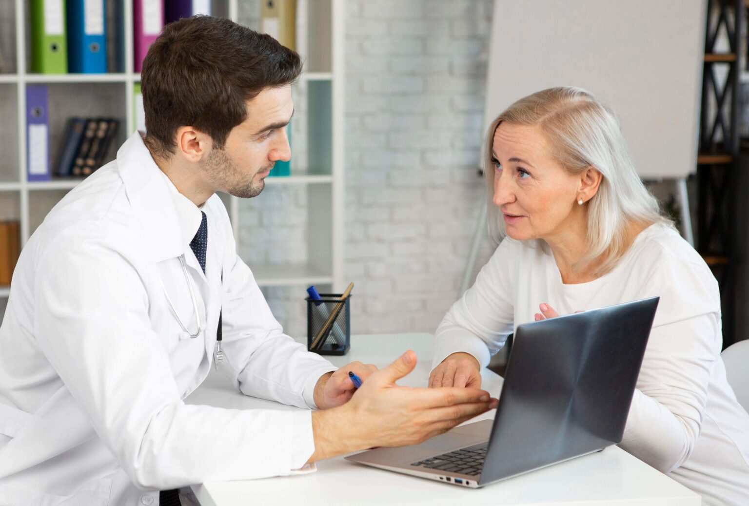 An occupational health clinician discussing an assessment with an employee