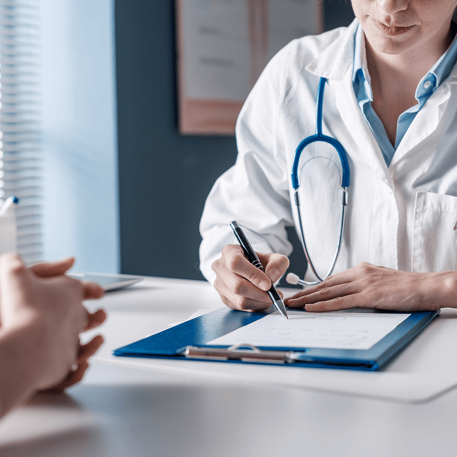 Occupational health doctor completing an assessment report